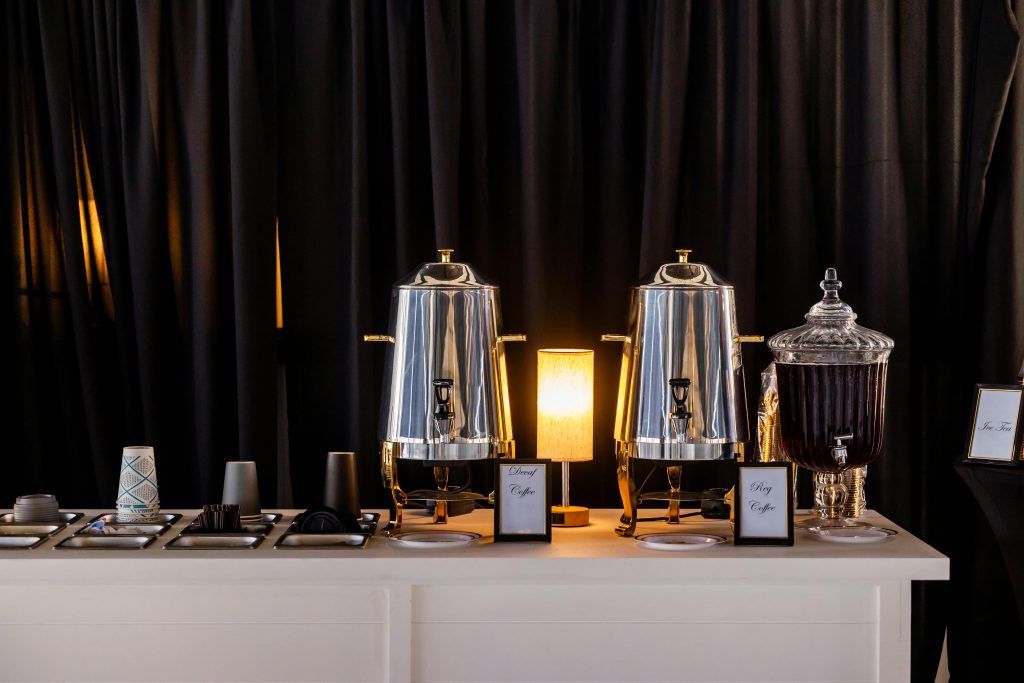 pexels photo 34597470 34597470 Stylish coffee station setup with polished dispensers and glassware for events.
